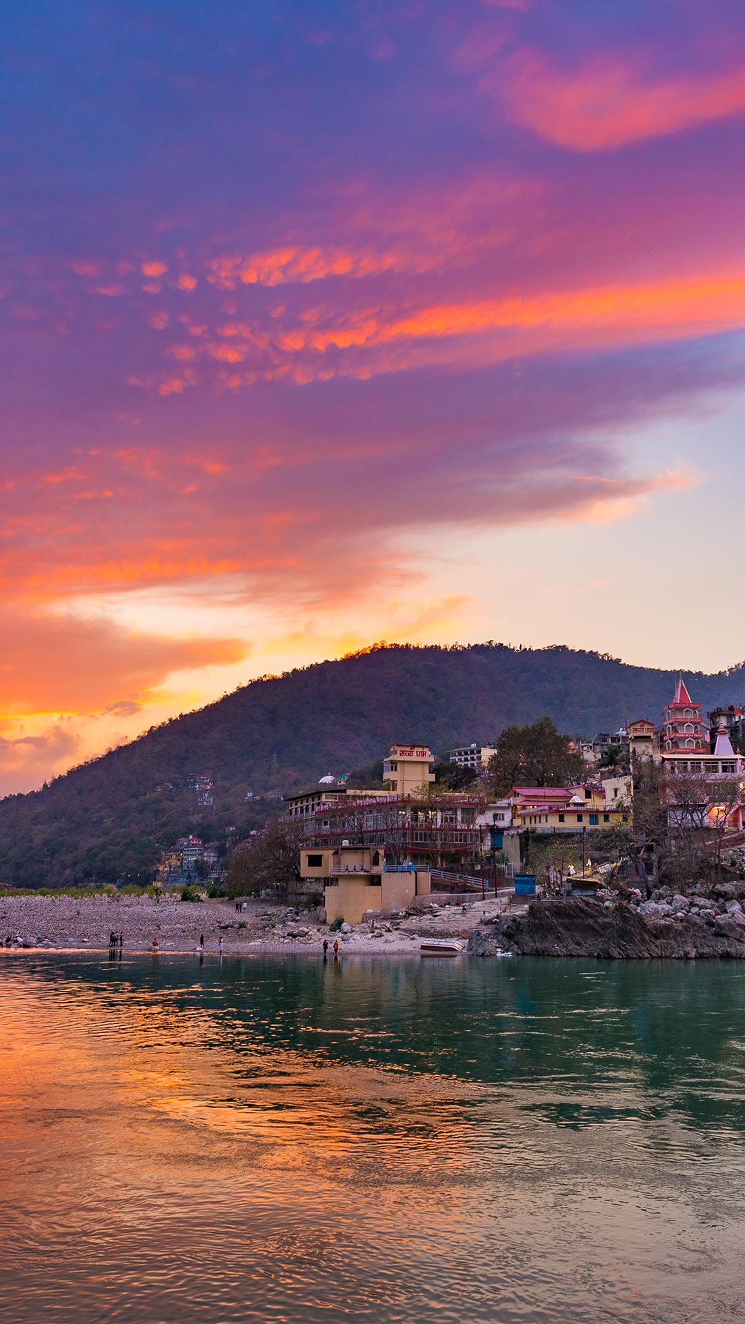 Colourful sky and clouds reflecting over the Ganges River, Rishikesh [Bing daily homepage wallpaper 1080x1920]